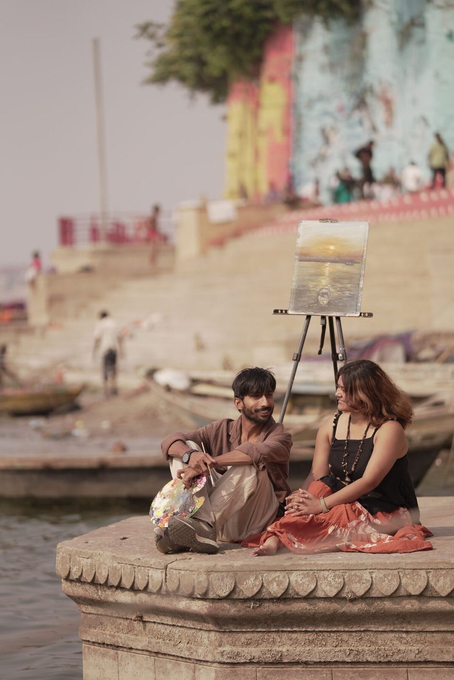 Aryan and Bharti painting together on the ghats of Varanasi